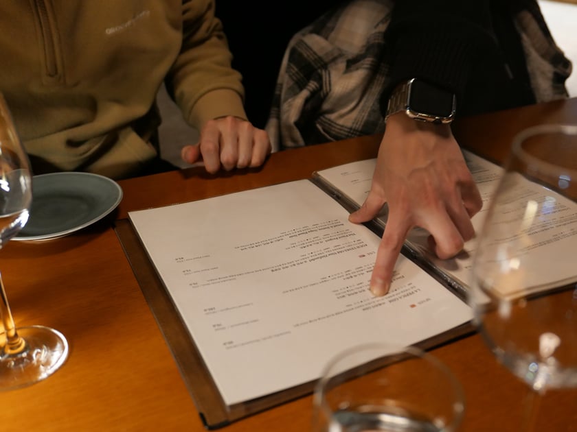 Person pointing at paper
