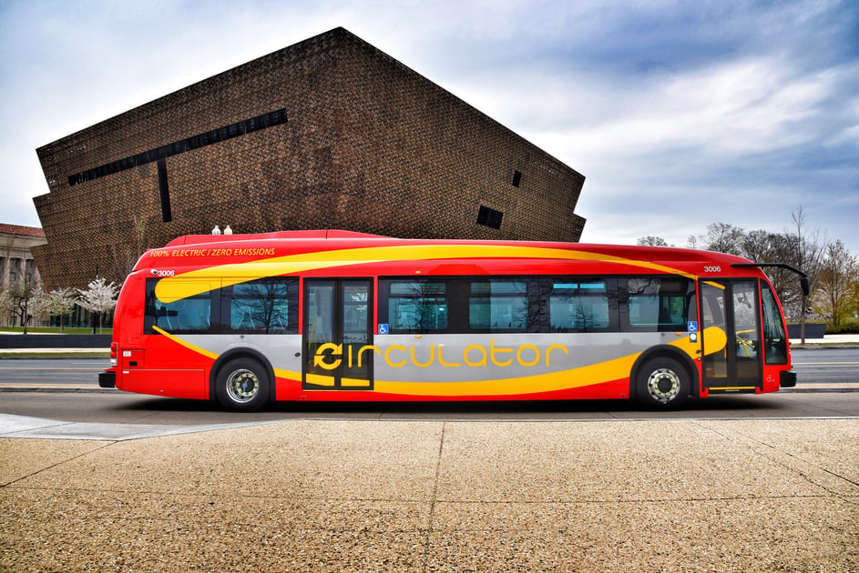 Red and yellow DC Circulator electric bus
